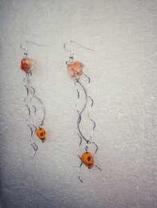 Jellyfish with pirate skull earrings